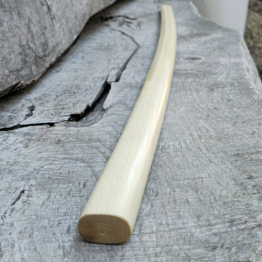 High-quality wooden bokken for martial arts training, crafted from durable wood with a smooth finish. Ideal for kendo, aikido, and samurai sword practice