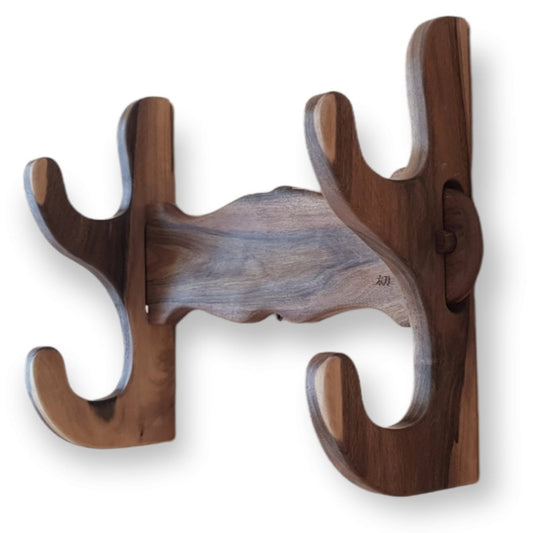 Multipurpose wooden display stand for sword, axe, and rifle.
