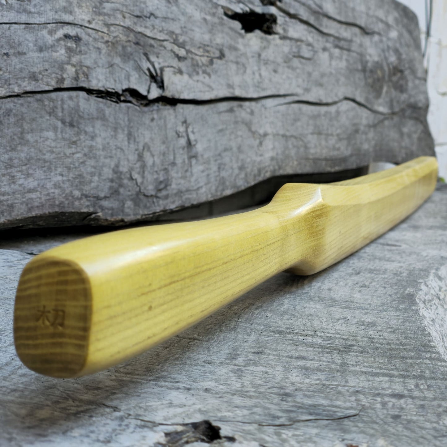 Heavy wooden suburito bokken for strength and technique training in kendo and aikido. Made from solid hardwood with a smooth, balanced design