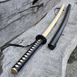 Sword with black sheath on a wooden surface