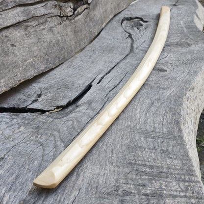 High-quality wooden bokken for martial arts training, crafted from durable wood with a smooth finish. Ideal for kendo, aikido, and samurai sword practice.