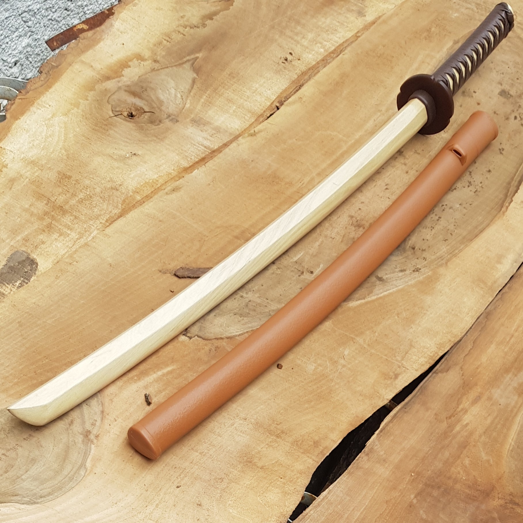 Wooden bokken daito with brown plastic tsuba, plastic saya and
