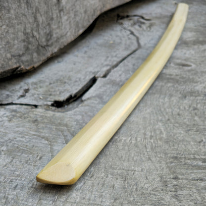 High-quality wooden bokken for martial arts training, crafted from durable wood with a smooth finish. Ideal for kendo, aikido, and samurai sword practice