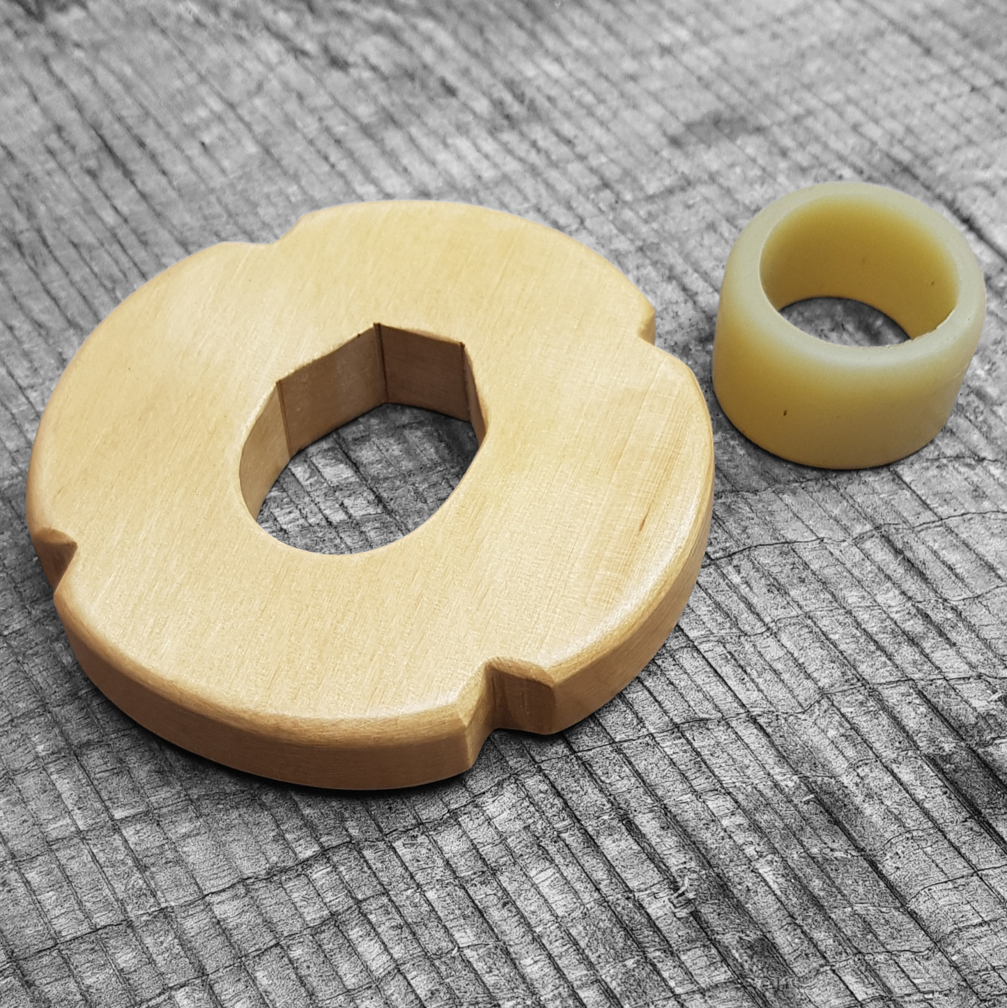 Wooden tsuba for bokken, displayed with a rubber stopper.