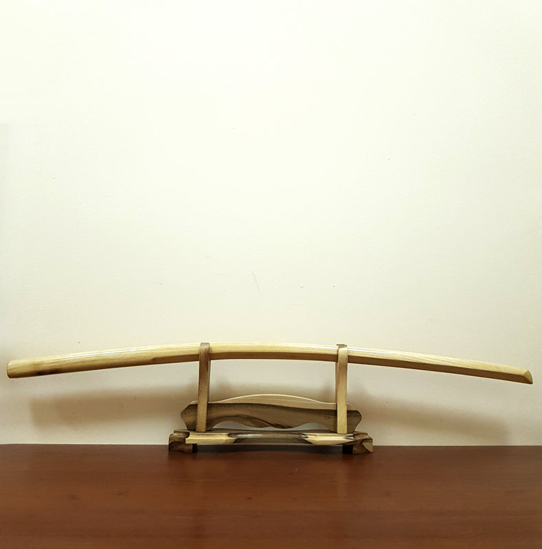 High-quality wooden bokken for martial arts training, crafted from durable wood with a smooth finish. Ideal for kendo, aikido, and samurai sword practice.