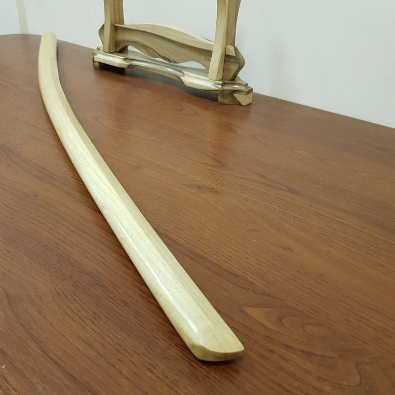 High-quality wooden bokken for martial arts training, crafted from durable wood with a smooth finish. Ideal for kendo, aikido, and samurai sword practice.