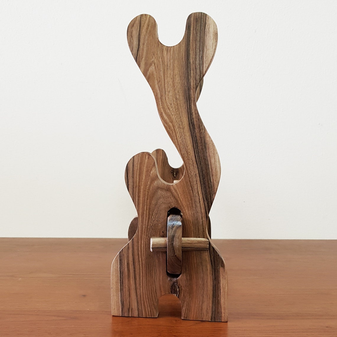 Traditional wooden sword rack for showcasing katanas and historical weapons.