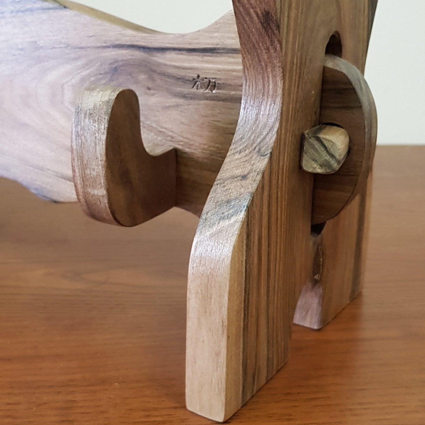 Traditional wooden sword rack for showcasing katanas and historical weapons.