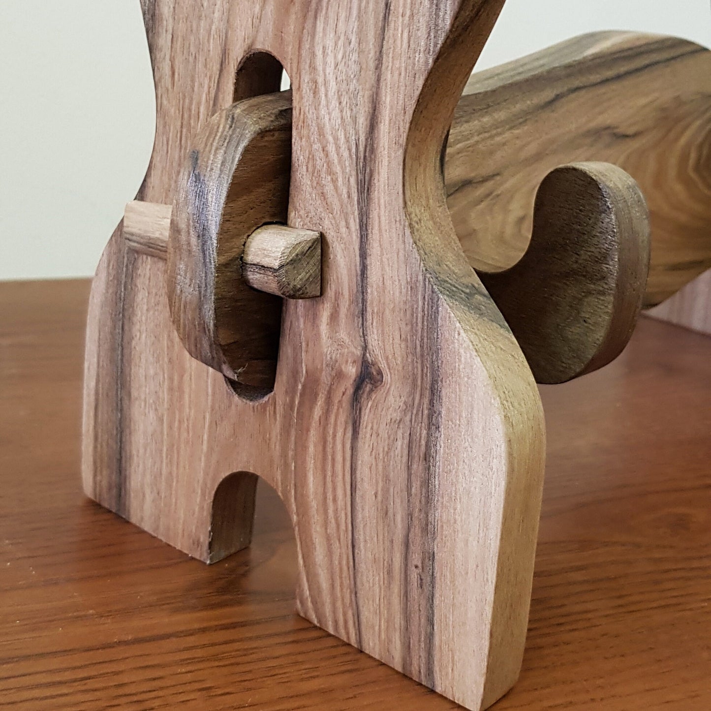 Traditional wooden sword rack for showcasing katanas and historical weapons.